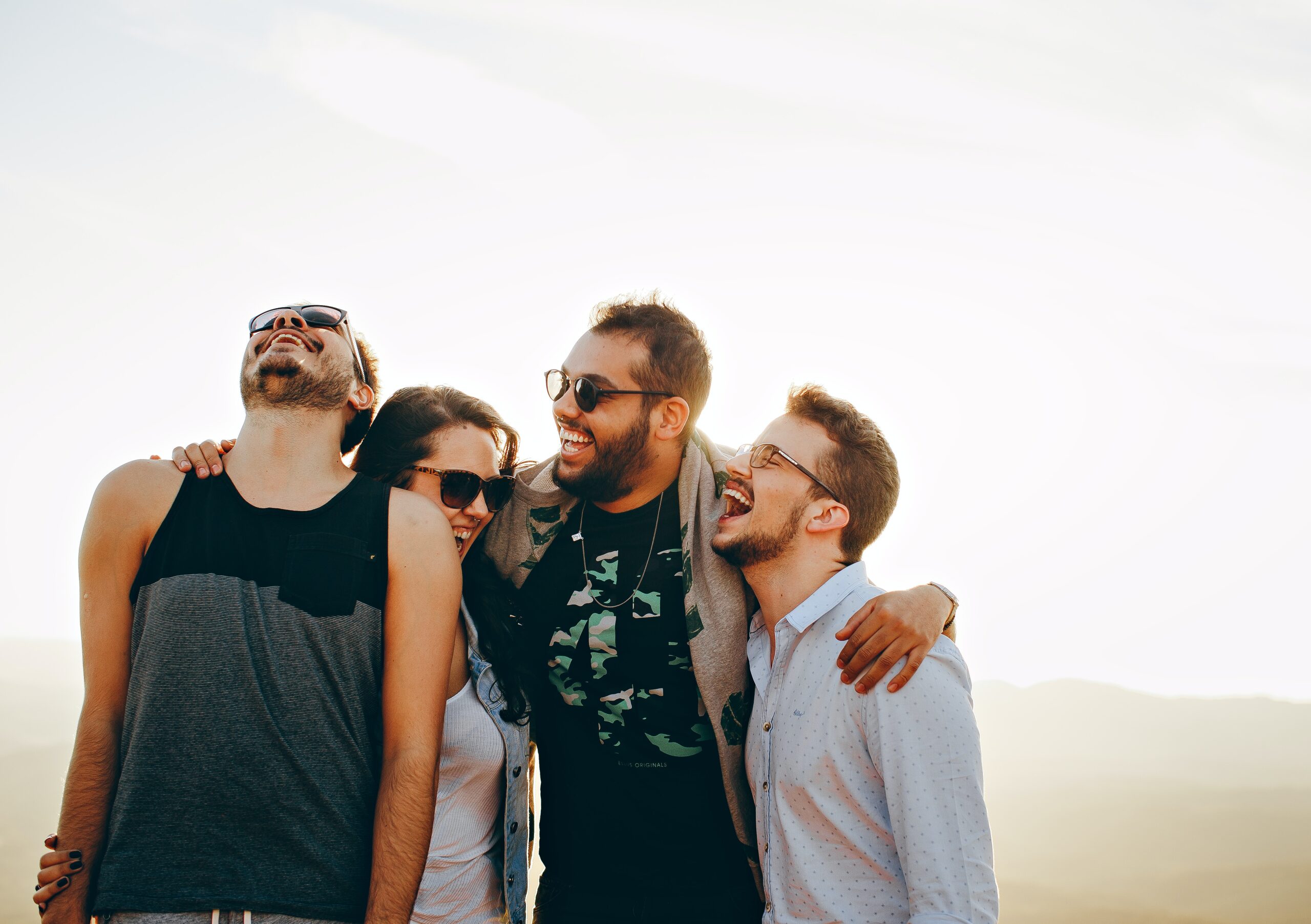 friends hugging and laughing